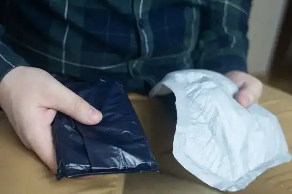 image of man holding stool incontinence Cardiff products